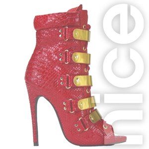 NELLY BERNAL ON FLEEK RED SNAKE BOOTIES